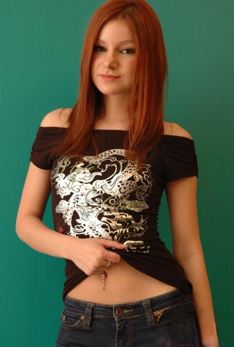 Natural redhead Korina Bliss covers her naked tits in a pair of denim jeans 78051760