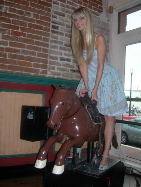 Blonde teen Jana Jordan licks an ice cream cone before straddling a toy horse 27797535