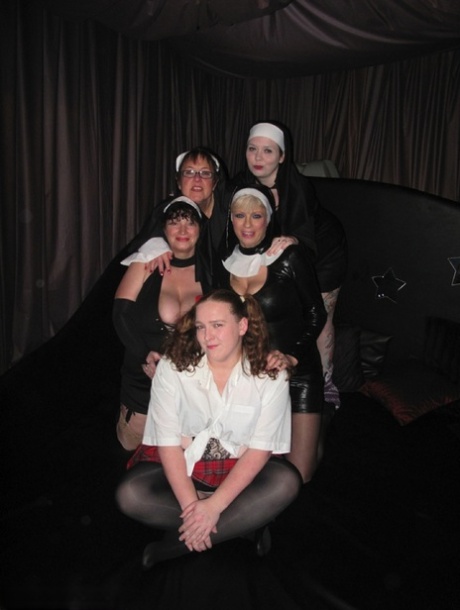 Fat chick is paddled and masturbated by mature nuns upon a bed 29692729