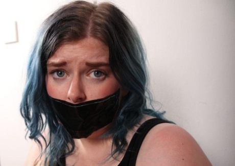 Caucasian plumper is tied to a chair while gagged in fishnet pantyhose 12593633