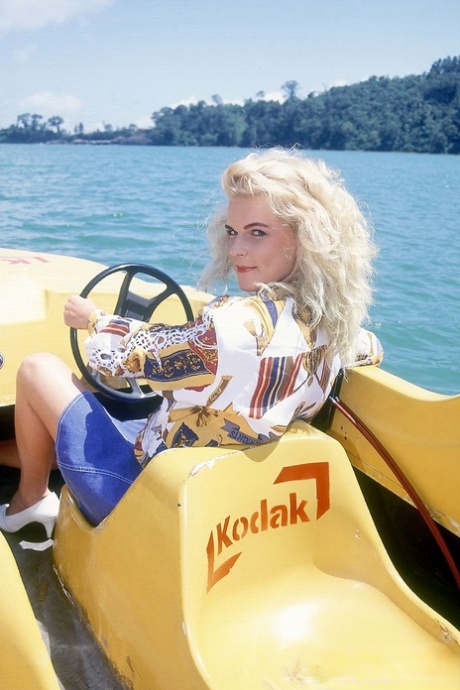 Busty blonde gets involved in a double penetration on top of a paddle boat 99998898