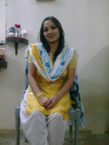 Overweight Indian student shows her bare mid-section in a brassiere 73378501