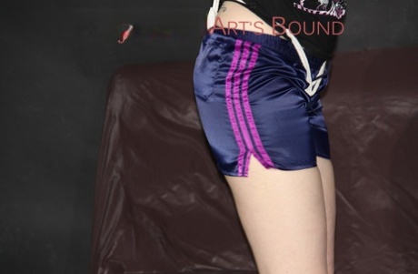 White girl has a length of cord jammed up her crotch in nylon gym shorts 29881569