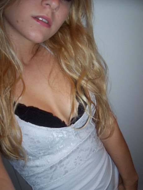 Blonde amateur Kylie takes mirror selfies while disrobing to her bra and thong 57390308
