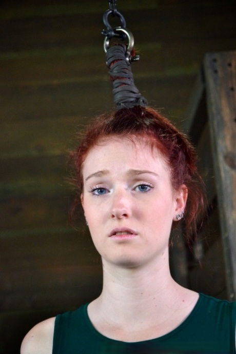 Pale redhead Ashley Lane submits to spending a day of her life in bondage 21725170