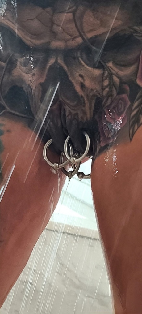 Tatted older woman Marie Bossette highlights her pierced pussy while showering 84935895