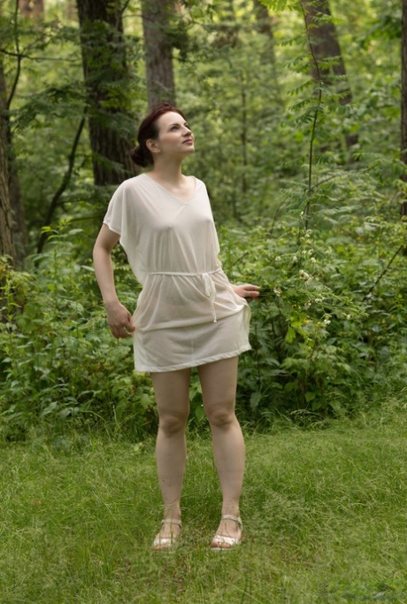 Skinny redhead Lisa Musa strips off her clothes near a pond 72718203