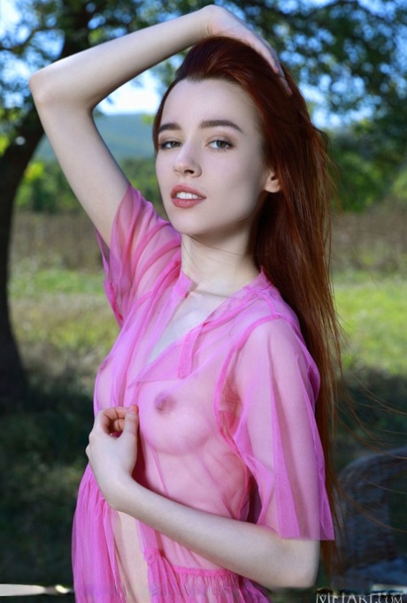 Thin redheaded teen Sherice strikes great nude poses under a shade tree 63819357