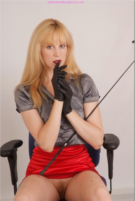 Fair skinned woman wields a whip in leather gloves during upskirt action 90201872