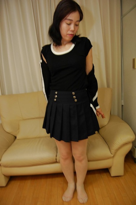 Shy asian MILF in nylons slowly getting rid of her clothes 67918467