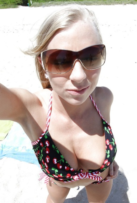 Blonde beach babe Britney Brooks posing fully clothed in denim jeans 32622019