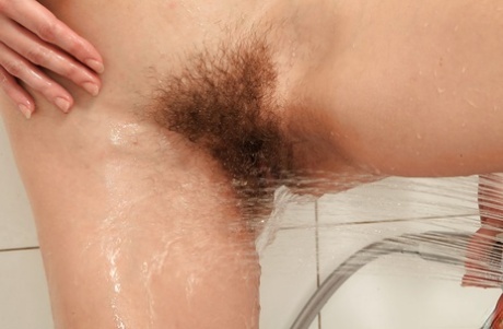Mature brunette woman undressing for hairy pussy masturbation in shower 20153102