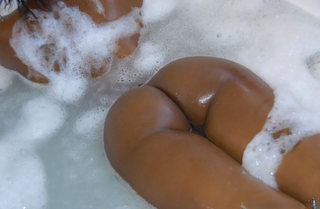 Ebony beauty Kim Kandy shows off her sexy butt while taking a bubble bath 79404917